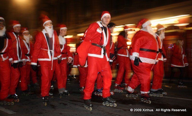 People dressed up as Santa Clause, roller-skating to the church.